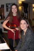 Loretta and Ainslee are friends who play the violin and piano together