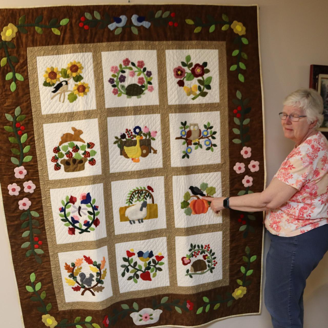 Barbara Boothe shows her lovely quilt